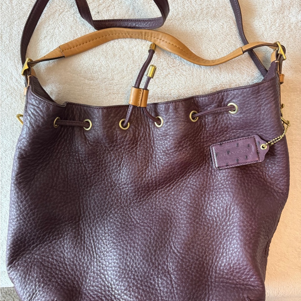Coach Pebbled Leather Drawstring Shoulder Bag in Plum with Tan Trim